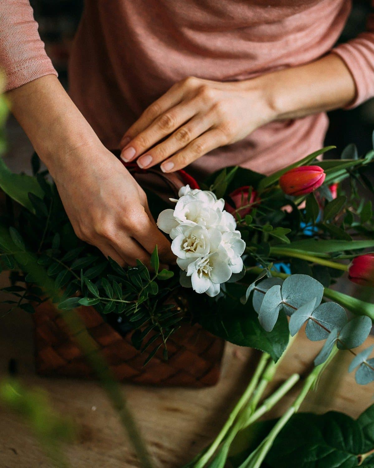 A florist arranging a bouquet